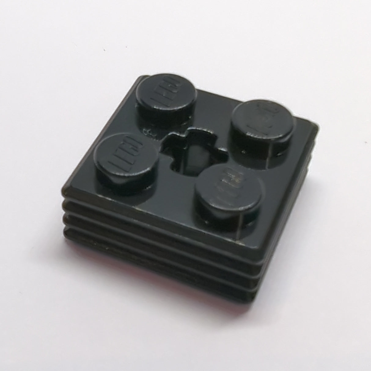 NEU Brick, Modified 2x2x2/3 Ribbed with Axle Hole Schwarz black