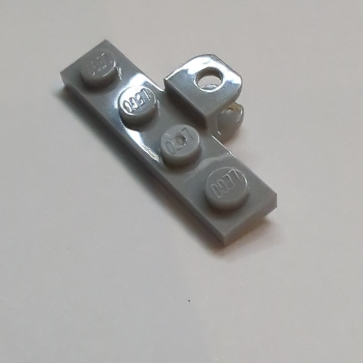 NEU Plate, Modified 1 x 4 with Tow Ball Socket, Flattened with Holes neuhellgrau light bluish gray