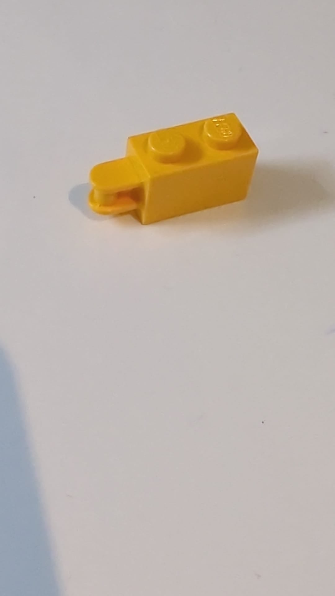 1x2 Modifizierter Stein mit Stangengriff am Ende – Stangeneinlass von der Kante hellorange