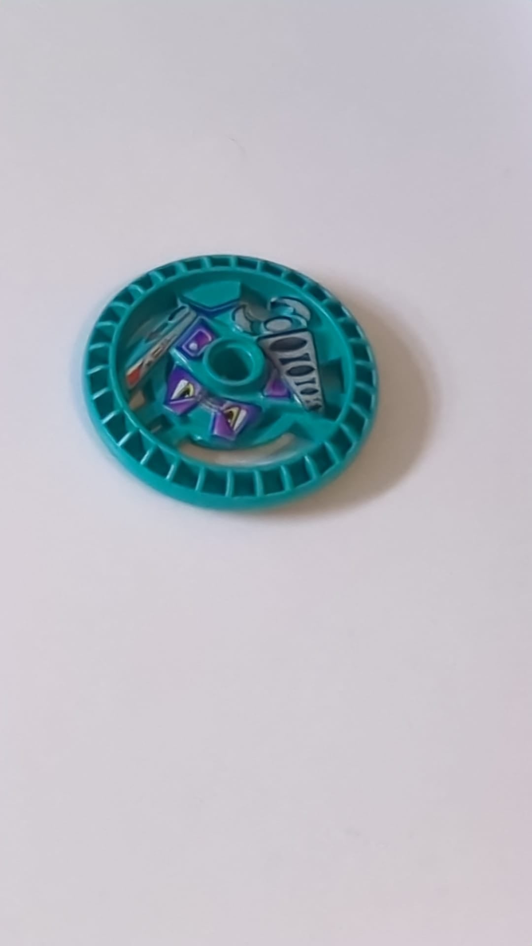 5x5 Tecnik Disk – RoboRider-Talisman-Rad, Greif-Form mit Robotermuster türkis