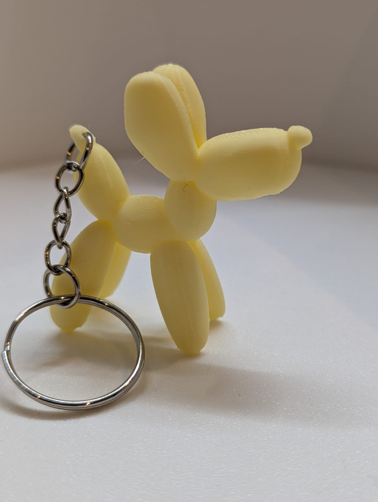 Luftballonhund Schlüsselanhänger 3D einfarbig hellgelb
