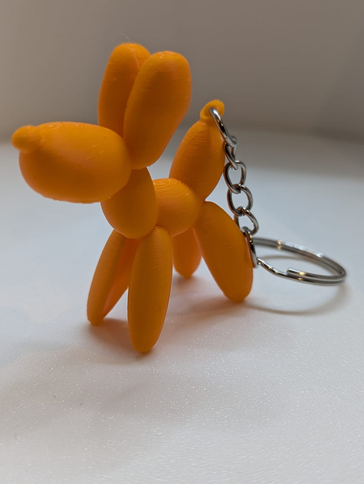 Luftballonhund Schlüsselanhänger 3D einfarbig orange