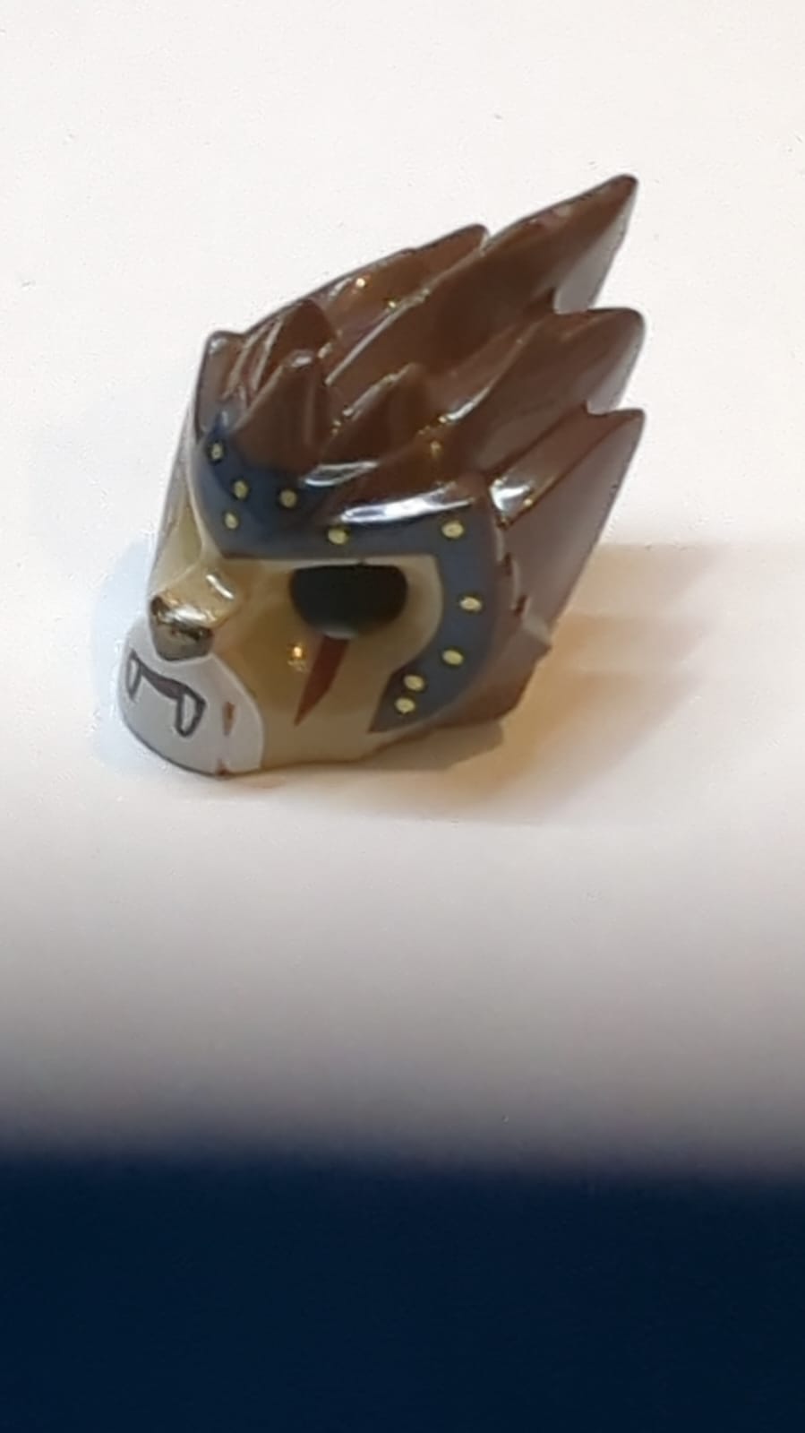 Minifigure, Headgear Mask Lion with Dark Tan Face, Dark Red Scar and Dark Blue Headpiece with Gold Circles Pattern