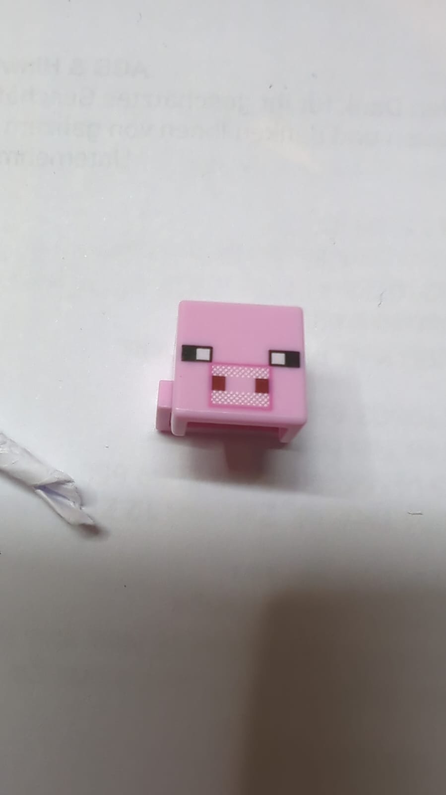 Kreaturenkopf verpixelt mit schwarzen Augen und schlichter Schnauze mit dunkelrosa Umriss und dunkelrotem quadratischem Nasenlochmuster (Minecraft Pig) rosa