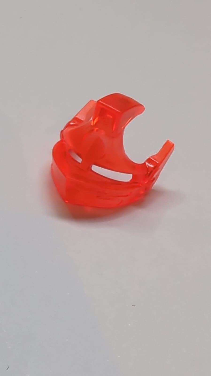 Minifigur, Visier spitz mit Augenschlitzen und Stacheln transparent neonorange