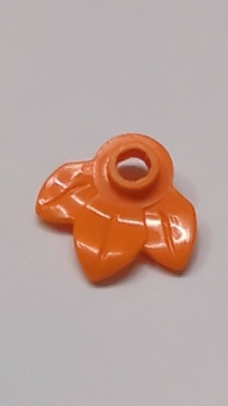 1x1 rund, Pflanze mit 3 Blättern orange