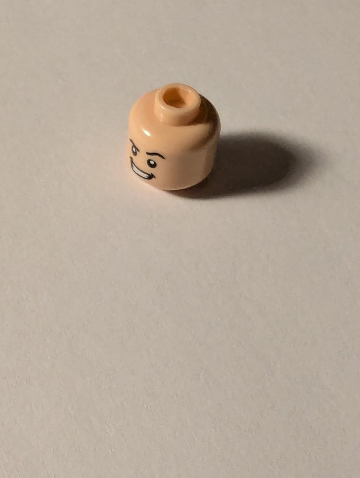 NEU Minifigure, Head Dual Sided Black Eyebrows, Medium Nougat Chin Dimple, Firm / Smile with Teeth and Raised Left Eyebrow Pattern - Hollow Stud hellnougat light nougat