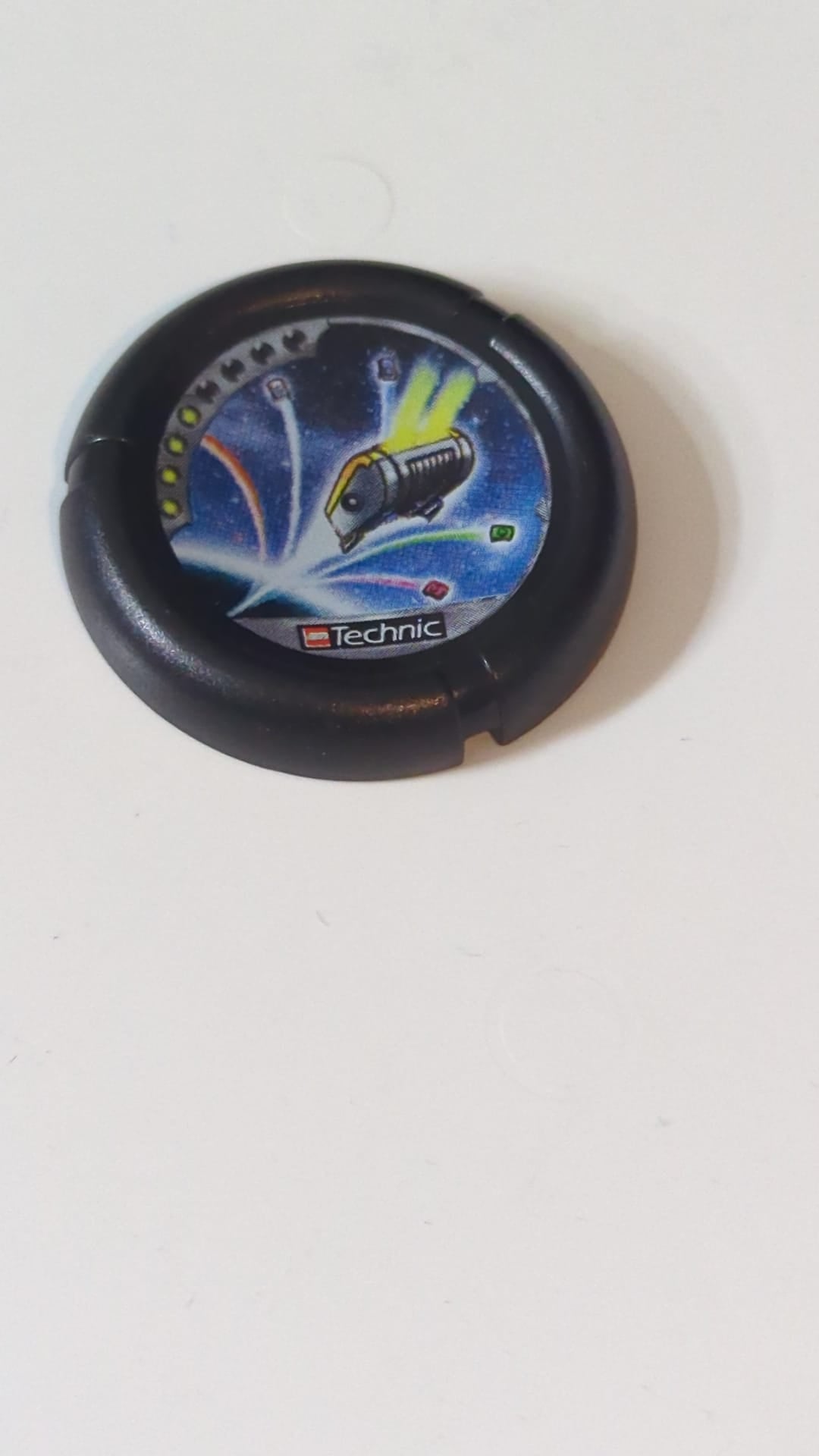 Wurfscheibe Disk mit Throwbot-Jet-Motiv / Slizer-Judge-Symbol (4 Punkte), LEGO Technic Logo und fliegenden Boxen im Weltraummuster schwarz