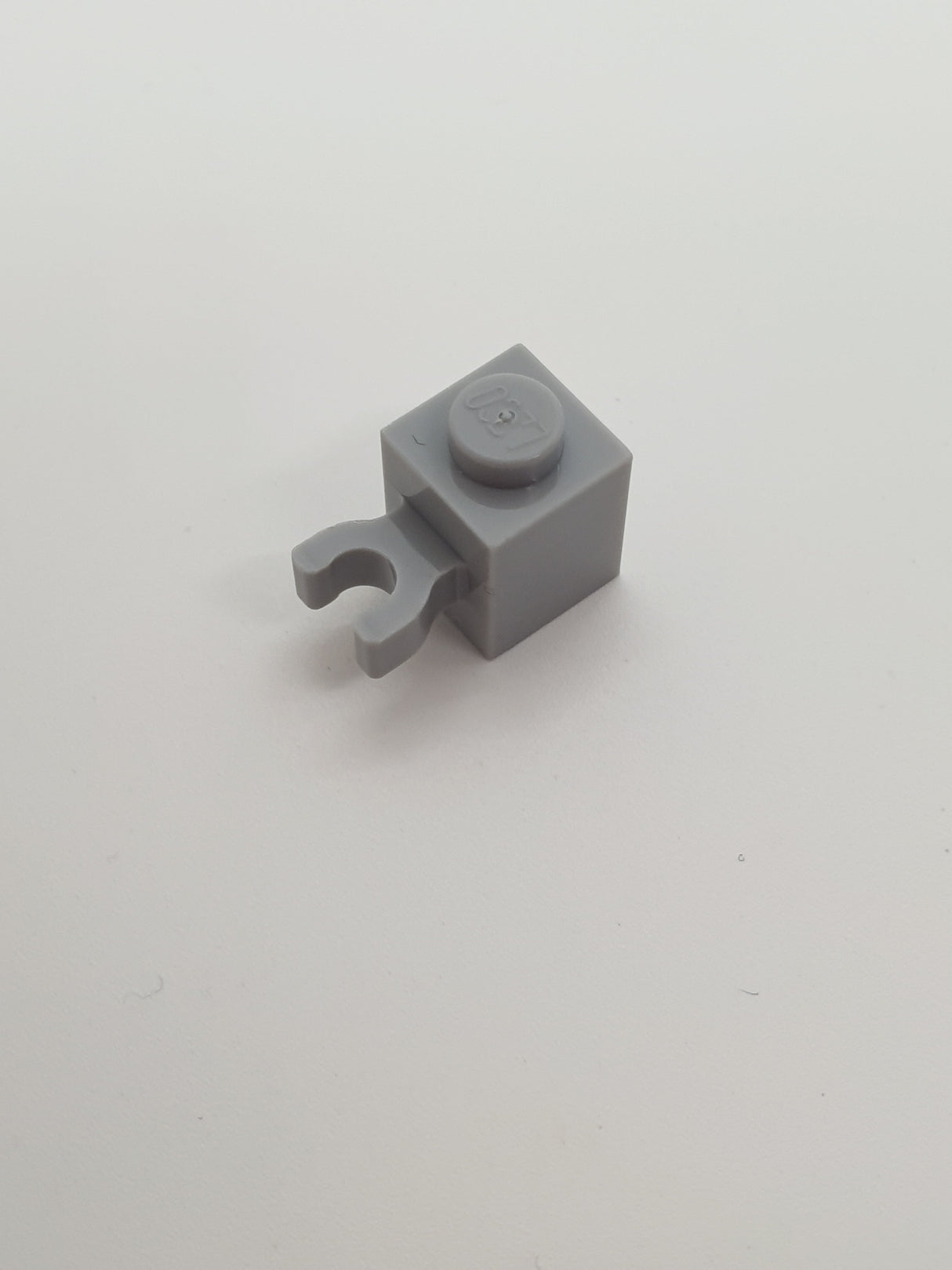 1x1 Stein mit Clip vertikal offene Noppe neuhellgrau