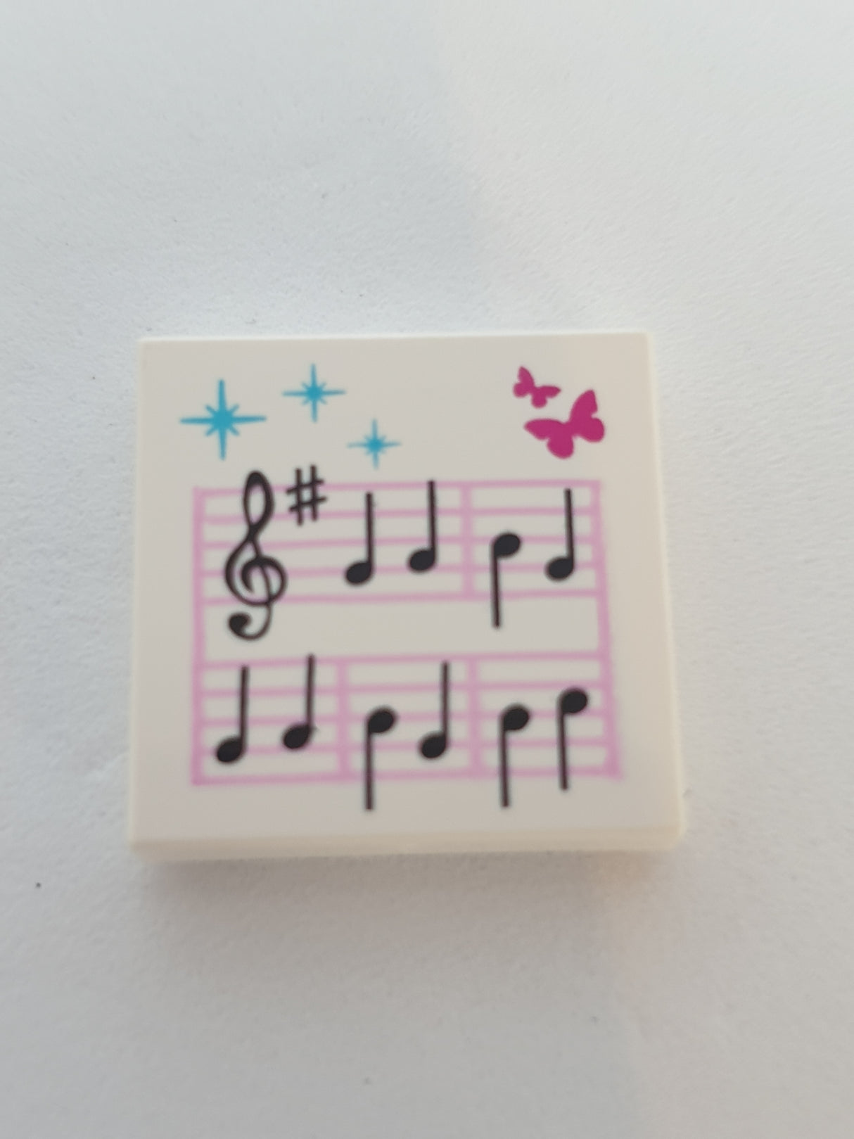 2x2 Fliese bedruckt mit Noten und Schmetterling