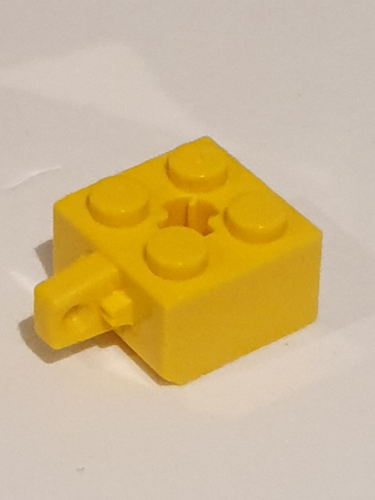 2x2 Scharnierstein mit 1 Fingern Kreuzloch + Achsloch gelb