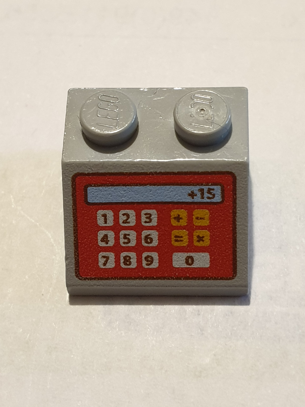 2x2 Dachstein 45° bedruckt with Red Cash Register and '+15' Pattern