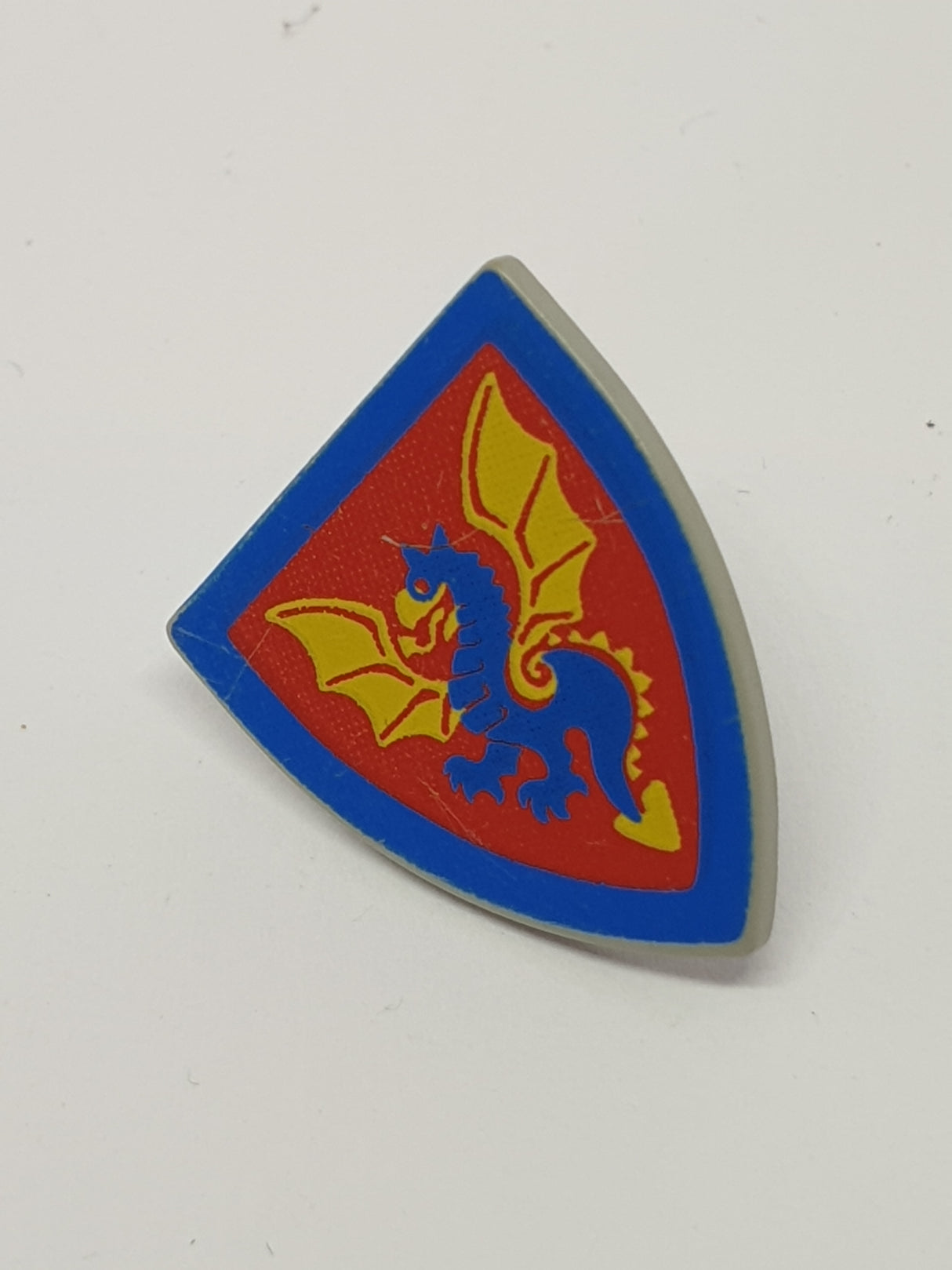 Schild bedruckt Triangular mit blau gelbem Drachen Aufdruck