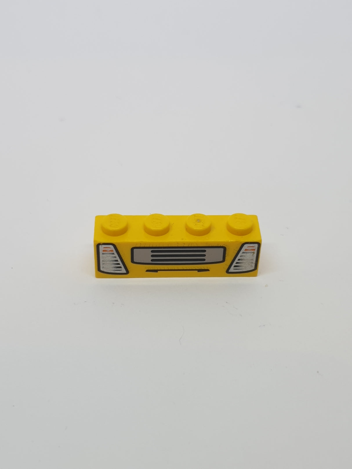 1x4 Stein bedruckt mit Truck Headlights and Grille Pattern (4 Juniors) gelb