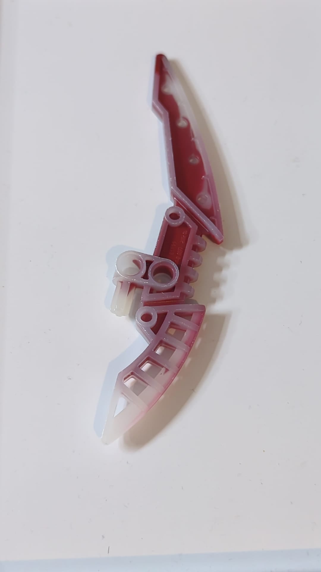 Bionicle-Waffenstab der Lichtklinge mit marmoriertem dunkelrotem Muster milchig weiß