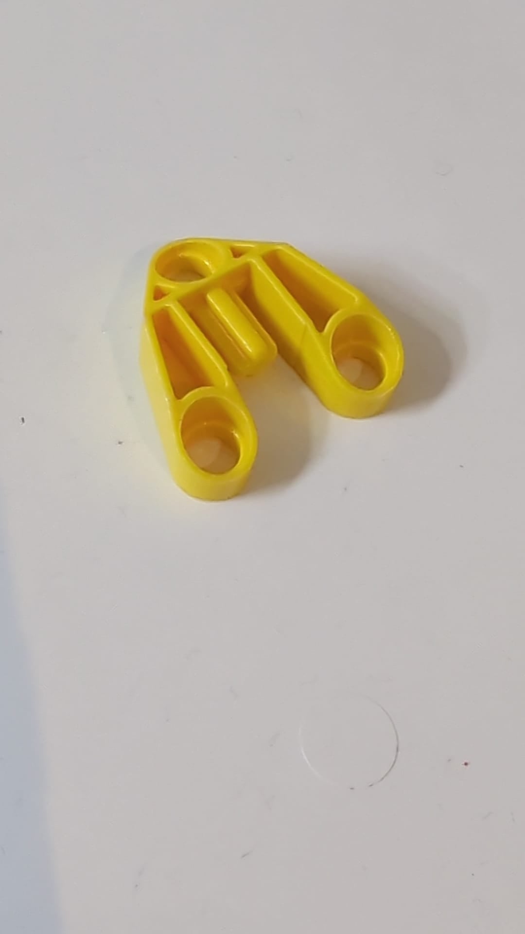 3x3 Technic, Stiftverbinder mit Achse und 3 Stiftlöchern gelb
