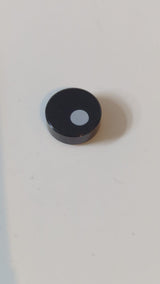 1x1 Fliese, rund, mit Muster: kleiner weißer Kreis / versetzte Pupille schwarz