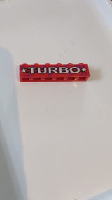 1x6 Stein mit weißem „TURBO“- und Sternenmuster rot
