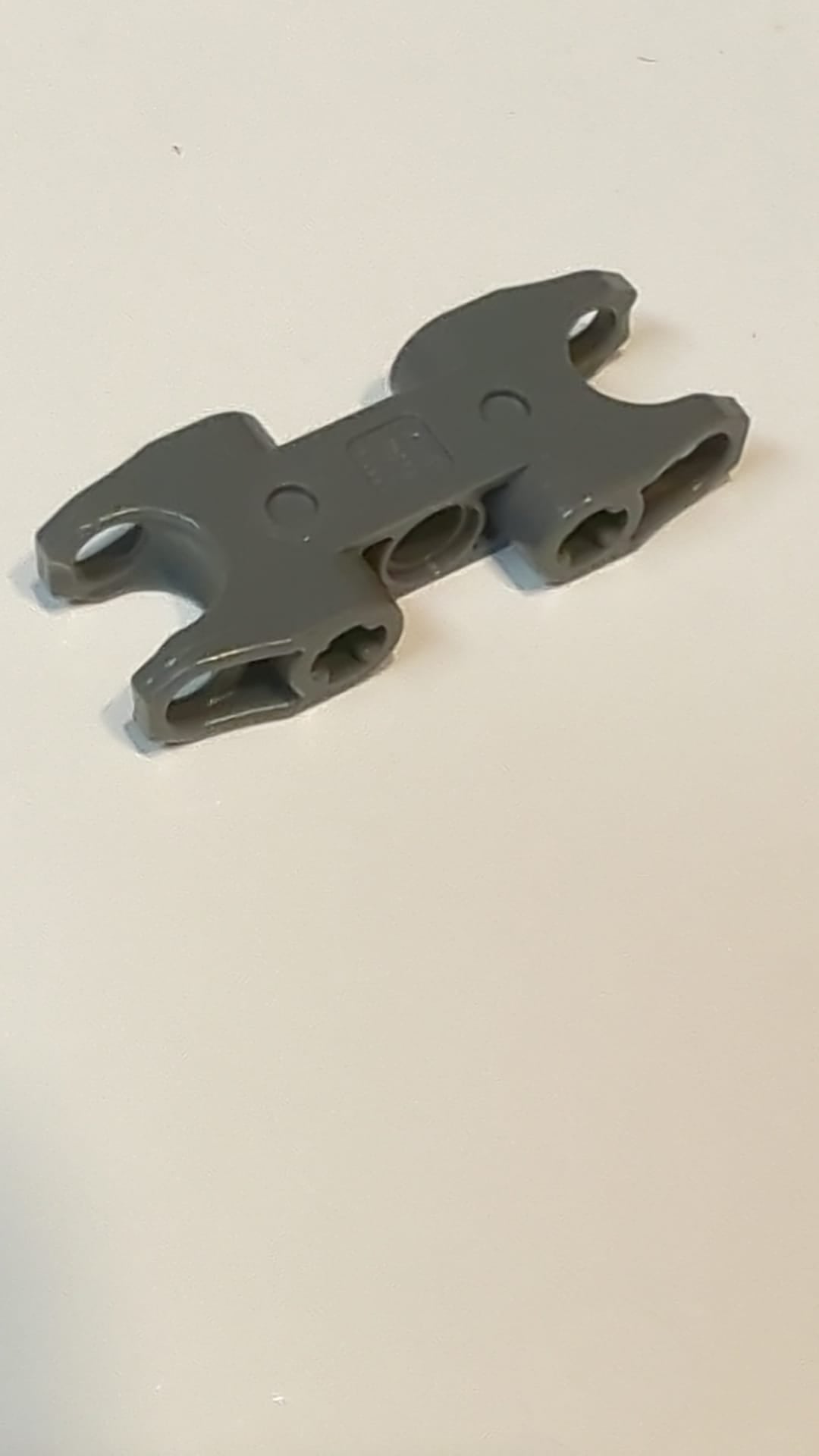 Technic, Achse- und Stiftverbinder 2 x 5 mit 2 Kugelgelenkaufnahmen, geschlossene Seiten, geschlossene Achslöcher neudunkelgrau
