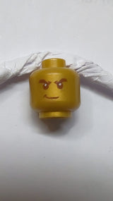 Kopf: Männlich, schwarz, buschige Augenbrauen, weiße Pupillen, verschmitztes Muster pearlgold