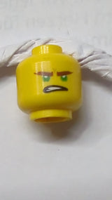 Kopf mit doppelseitigen rötlich-braunen Augenbrauen, grünen Augen, schief geöffnetem Mundgrinsen / zusammengebissene Zähne Muster (Lloyd) gelb