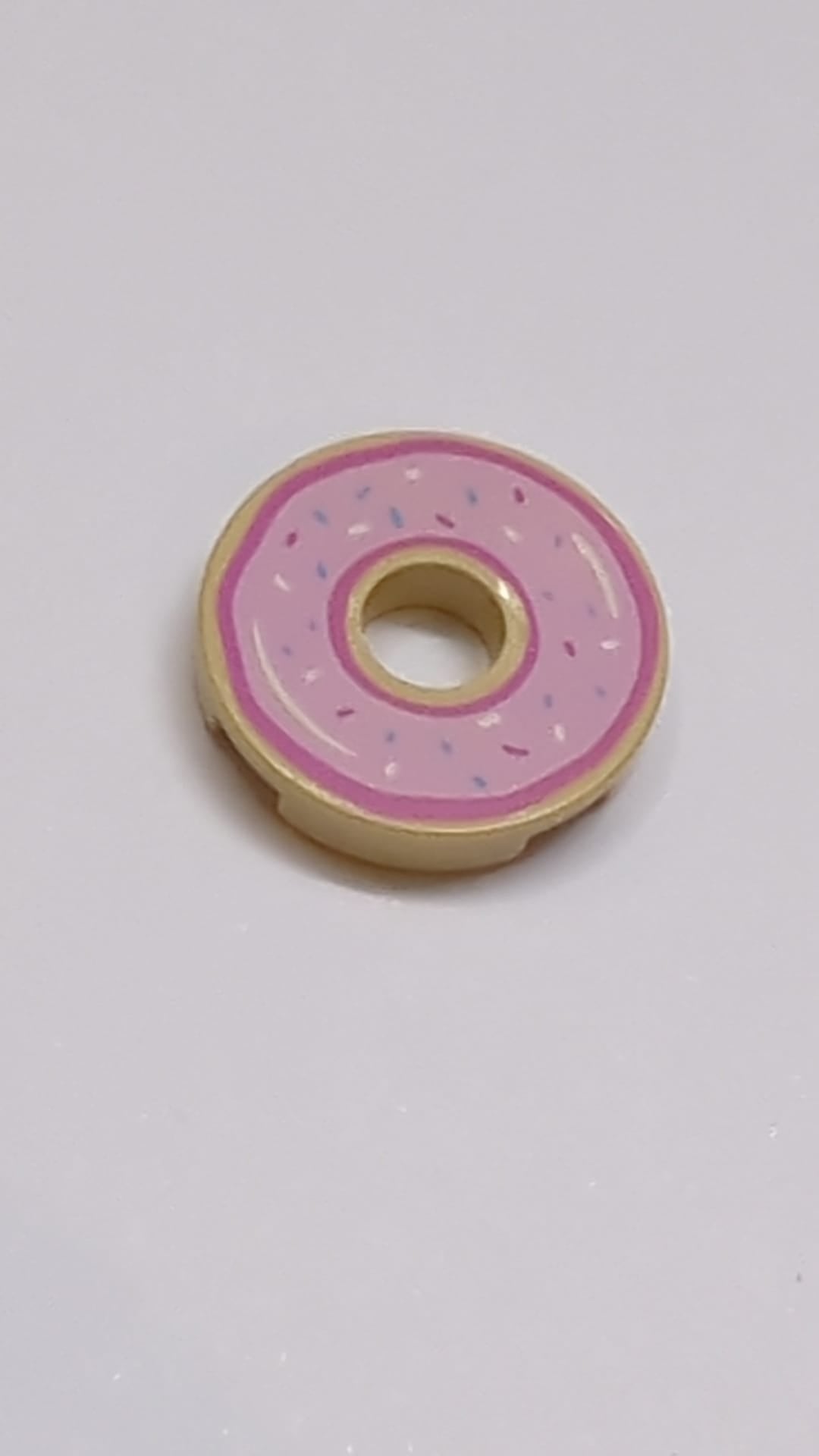 NEUE Fliese, rund 2 x 2 mit Loch, mit hellpinkem Donut-Glasur- und Streusel-Muster beige-tan