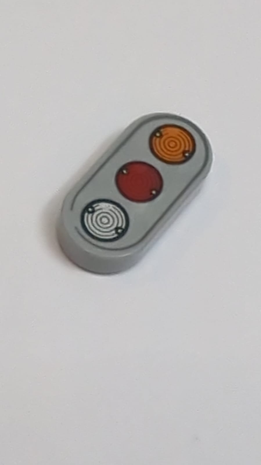 NEU Fliese, Rund 1 x 2 Oval mit Muster aus orange-, rot- und silberfarbenen Lichtern neuhellgrau