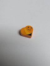NEU Tile, Round 1 x 1 Heart with Worm, Bright Light Orange Stripe, Black Eyes and Smile Pattern (Sesame Street Slimey) orange orange