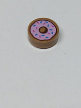 NEU Fliese, rund 1 x 1 mit Donut / Doughnut mit leuchtend rosa Glasur und Muster aus dunkelblauen und dunkelrosa Streuseln, nougat (medium)