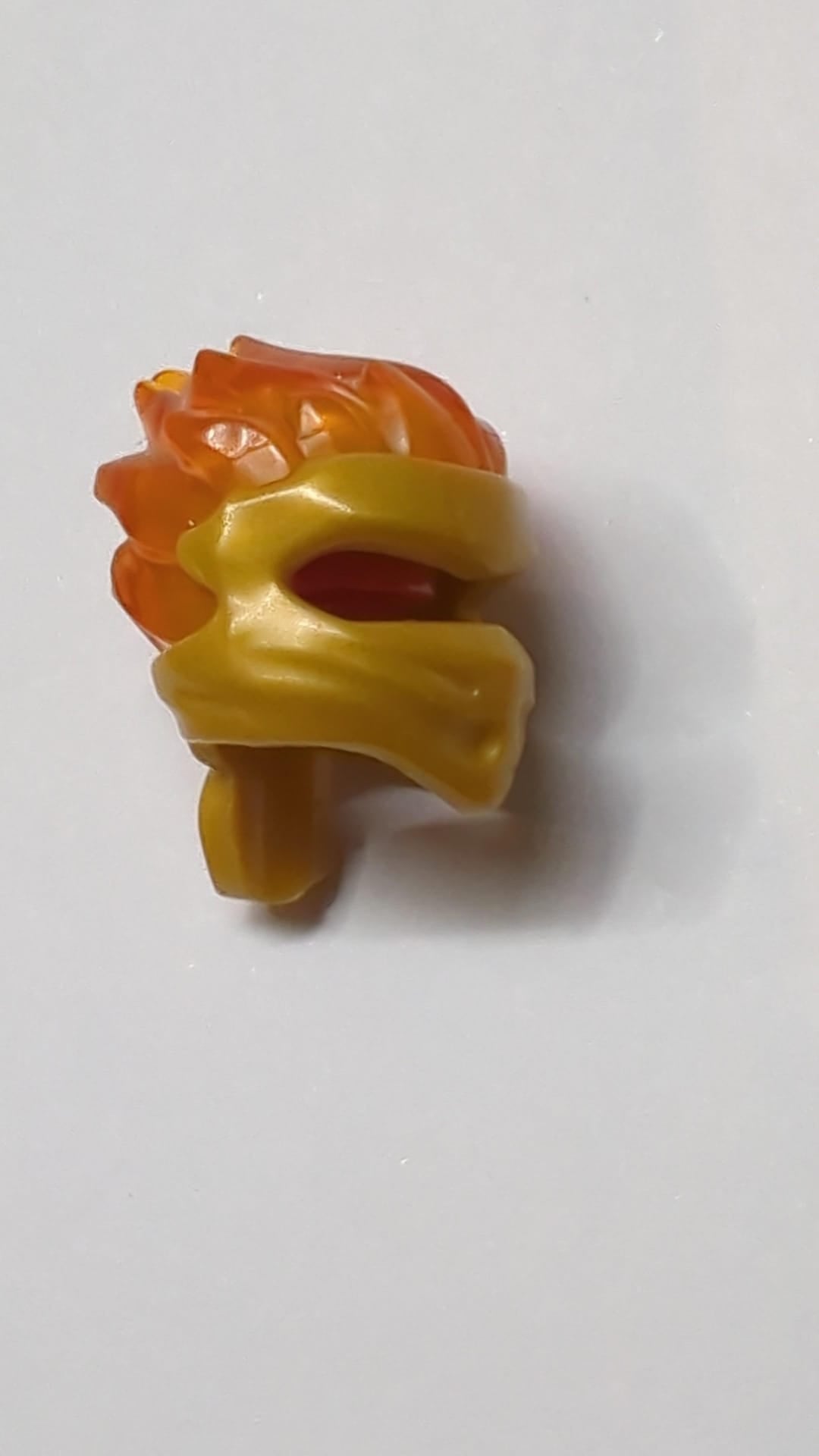 Minifigur, Kopfbedeckung Ninjago Wrap Typ 5 mit geformtem, durchscheinend orangefarbenem Flammenmuster pearlgold