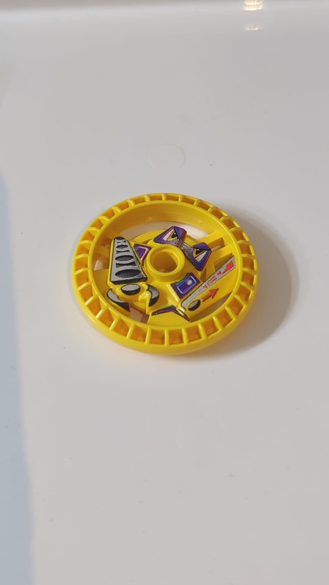 5x5 Technik Disk – RoboRider-Talisman-Rad, Greif-Form mit Robotermuster gelb