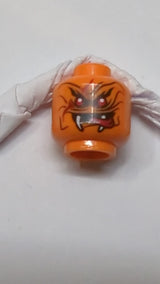 Minifigur, Kopf: Doppelseitiger Alien-Schlangenkopf mit schwarzen Wellenlinien, 2 roten Augen und 2 weißen Reißzähnen, neutrales/rotes gespaltenes Zungenmuster orange
