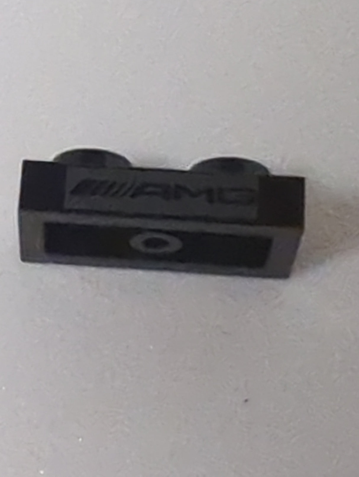 NEU Platte 1 x 2 mit AMG-Logo auf silbernem Hintergrundmuster schwarz