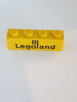 1x4 Stein bedruckt mit Legoland Schriftzug gelb