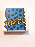 2x2 Fliese bedruckt with Groove with Yellow 'TURBO', Black Spots, Blue Background Pattern